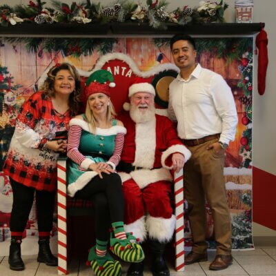 Photo of Santa and IW employees