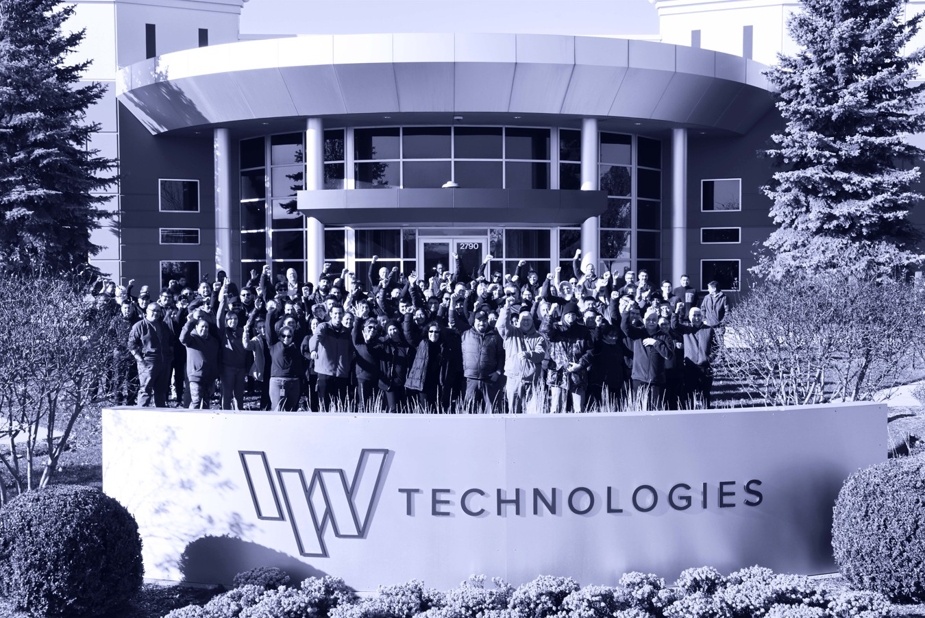 People at IW Photo of you enterprise solution parnter employees standing in front of IWTechnologies building.